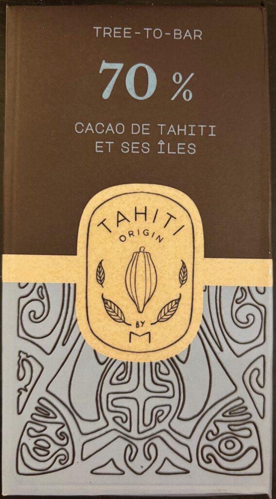70% dark chocolate bar from Tahiti with brown and blue paper packaging