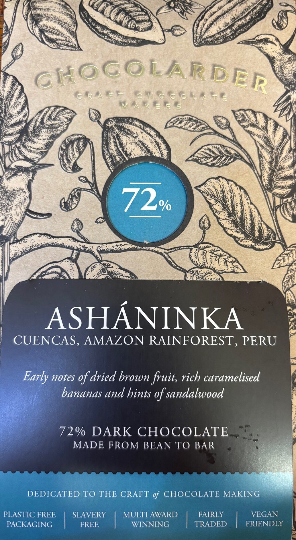 Front packaging of Chocolarder 72% Ashaninka Peru with sketches of leaves, cocoa bens and birds.