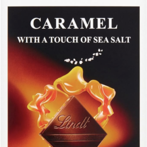 Front packaging of Lindt Dark Chocolate Caramel with Sea Salt. Image of Lindt Chocolate Square, caramel oozing out, and some sea salt
