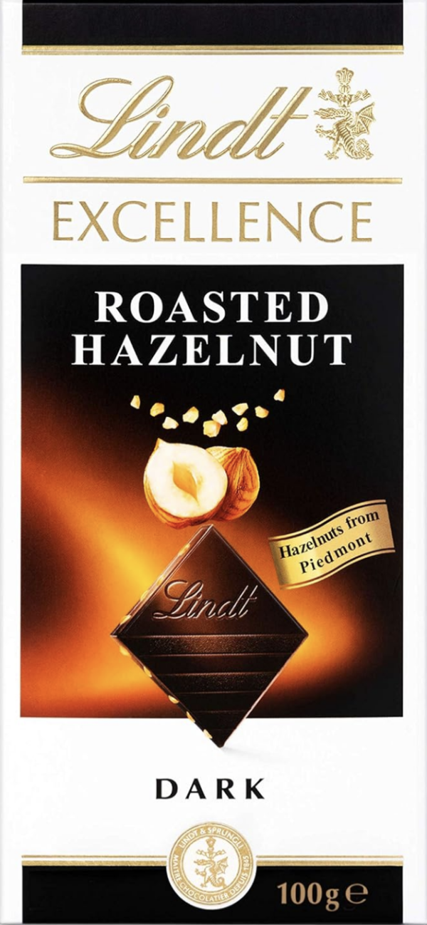 Front Packaging of Lindt Dark Roasted Hazelnut Image of Lindt chocolate square and hazelnuts