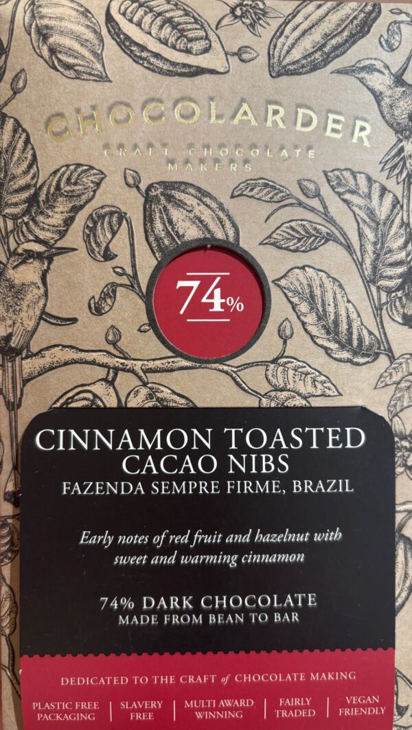 Front packaging of Chocolarder 74% Cinnamon Toasted Cacao Nibs with drawings of cocao beans and leaves