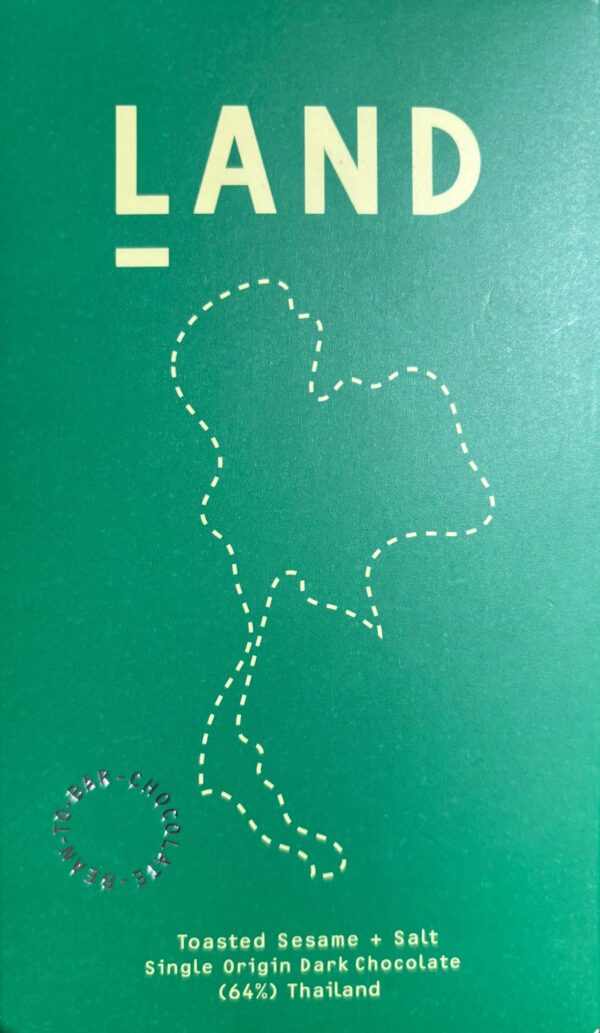 Front packaging of Land Toasted Sesame and Salt 64% with green background and dotted outline of the landmass of Thailand